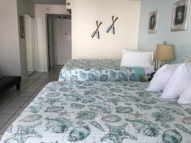 bedroom featuring light tile patterned floors