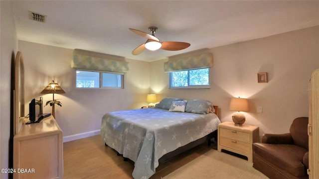 bedroom featuring ceiling fan and light wood-type flooring