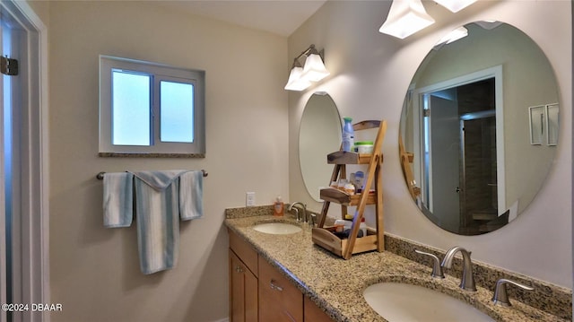 bathroom featuring vanity and an enclosed shower