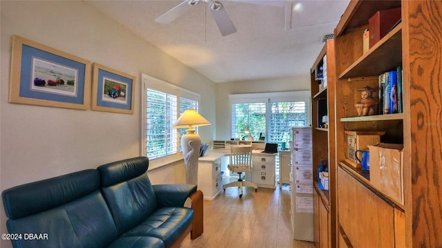 living room with ceiling fan and light hardwood / wood-style floors