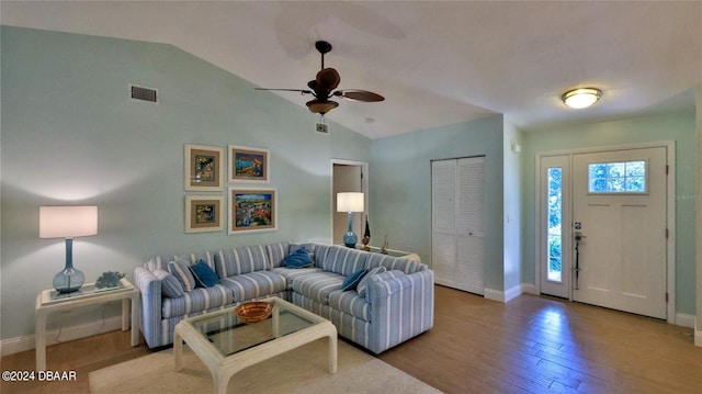 living room featuring light wood-type flooring, ceiling fan, and lofted ceiling