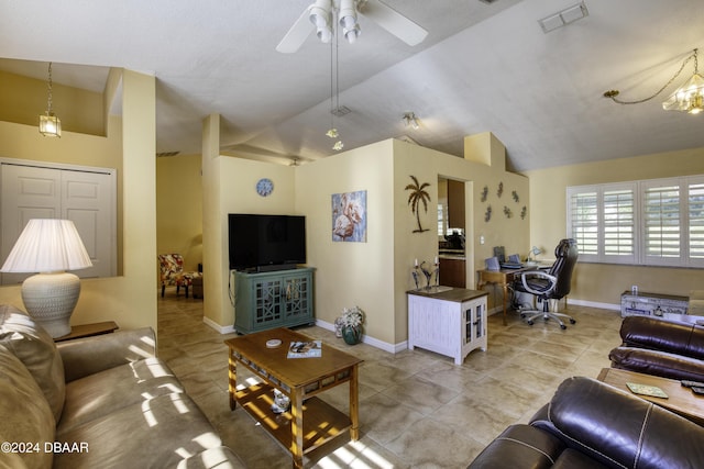 tiled living room featuring ceiling fan and lofted ceiling