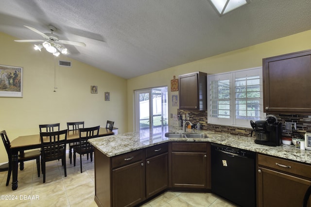 kitchen with kitchen peninsula, tasteful backsplash, vaulted ceiling, sink, and black dishwasher