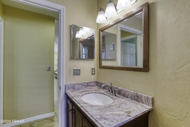 bathroom with tile patterned flooring and vanity