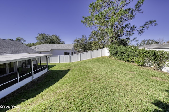 view of yard with a sunroom