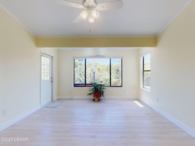 1307 Wayne Ave, New Smyrna Beach, FL 32168 - unfurnished room featuring light wood finished floors, crown molding, ceiling fan, and baseboards