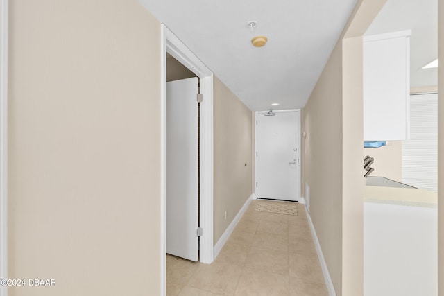 hallway featuring light tile patterned floors