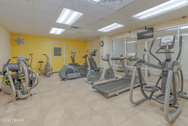 gym featuring a paneled ceiling