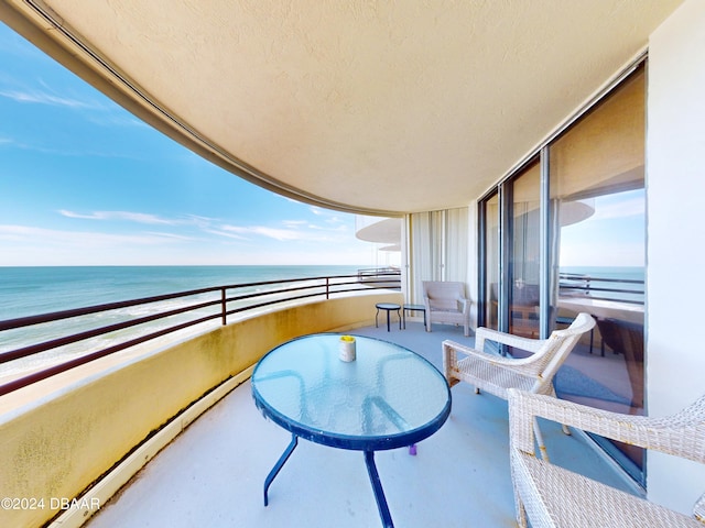 balcony featuring a water view