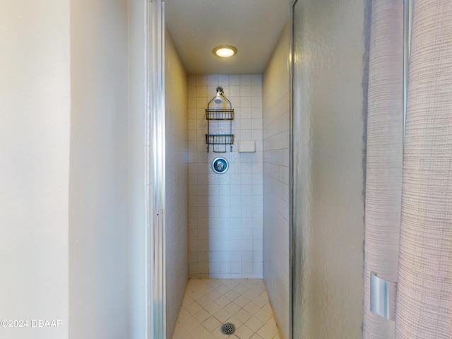 bathroom with a tile shower