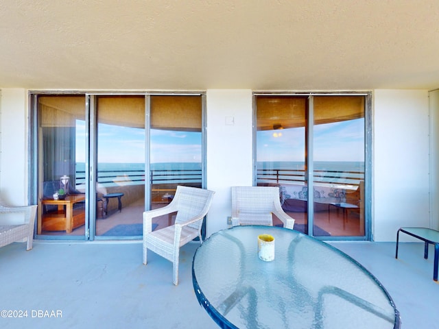 view of patio / terrace featuring a water view