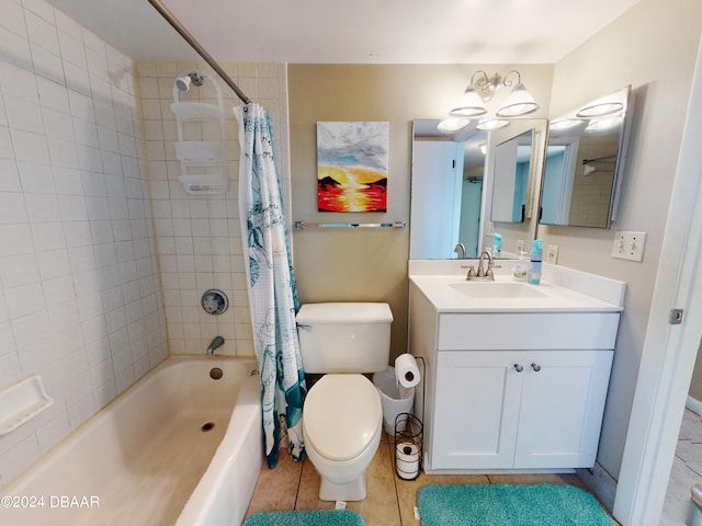 full bathroom with tile patterned flooring, vanity, shower / bath combo with shower curtain, and toilet