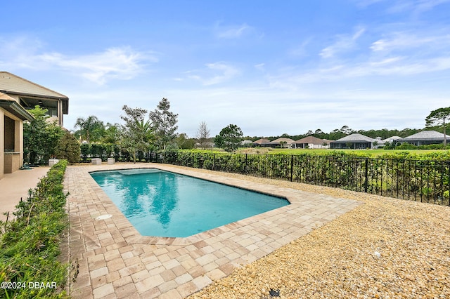 view of swimming pool with a patio