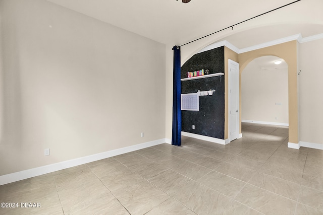 tiled empty room with ornamental molding