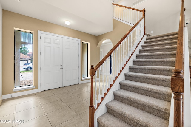 tiled foyer entrance featuring a wealth of natural light