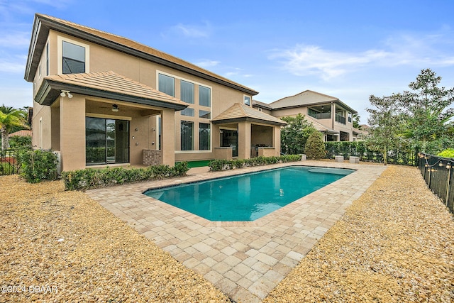 exterior space featuring a fenced in pool and a patio area