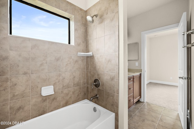 bathroom with vanity, tiled shower / bath, and tile patterned floors