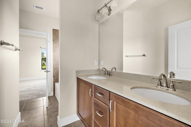 bathroom with vanity and tile patterned floors