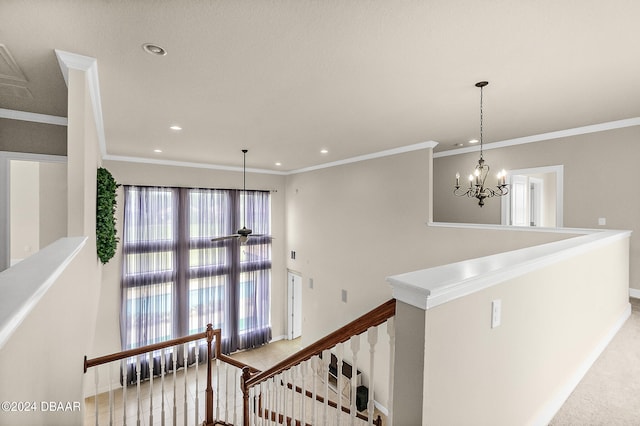 stairs featuring ornamental molding, carpet floors, and an inviting chandelier