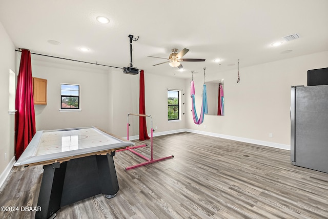 rec room featuring hardwood / wood-style floors and ceiling fan