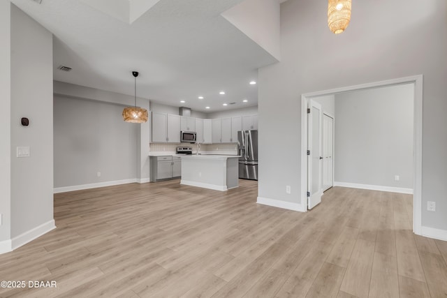 unfurnished living room with light hardwood / wood-style floors