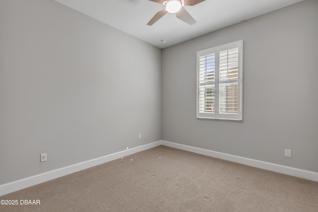 empty room featuring carpet floors and ceiling fan