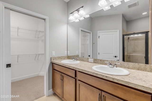 bathroom with vanity and an enclosed shower