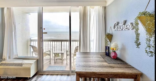2700 N Atlantic Ave Unit 652, Daytona Beach, FL 32118 - dining area featuring a textured wall and wood finished floors