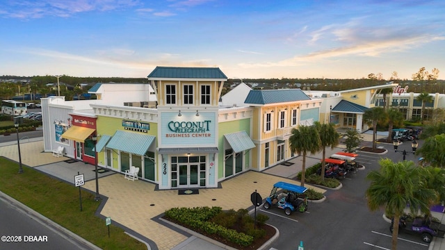 view of building exterior featuring uncovered parking