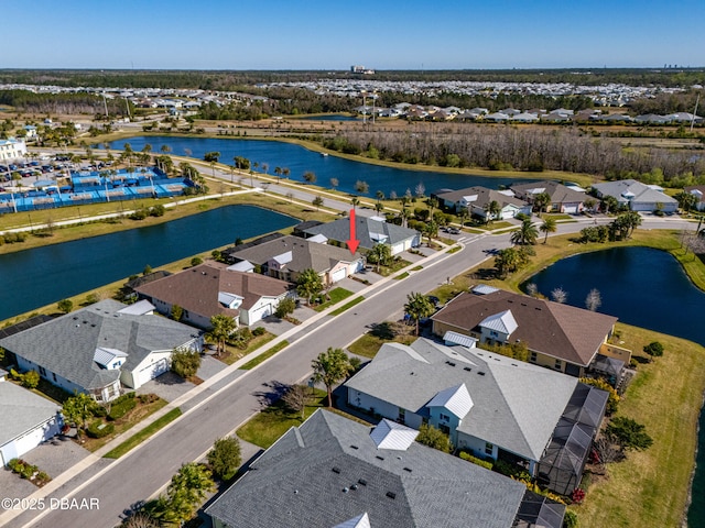 birds eye view of property featuring a residential view and a water view