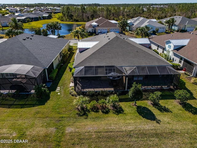 aerial view featuring a water view and a residential view