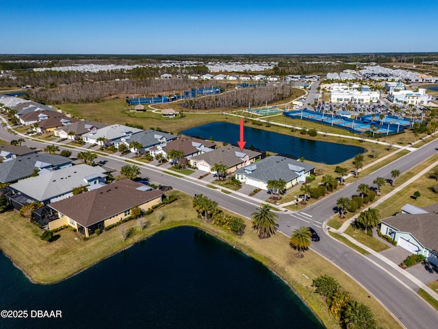 birds eye view of property featuring a water view and a residential view