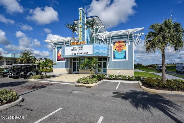 view of building exterior featuring uncovered parking