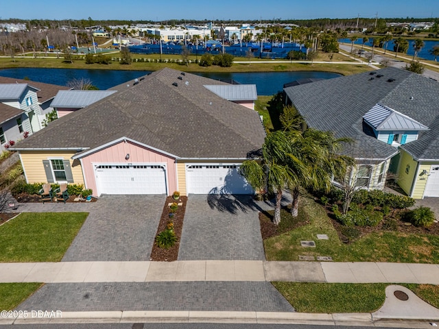 aerial view featuring a water view and a residential view