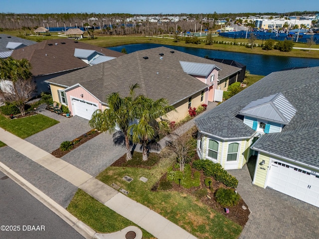 birds eye view of property featuring a water view and a residential view