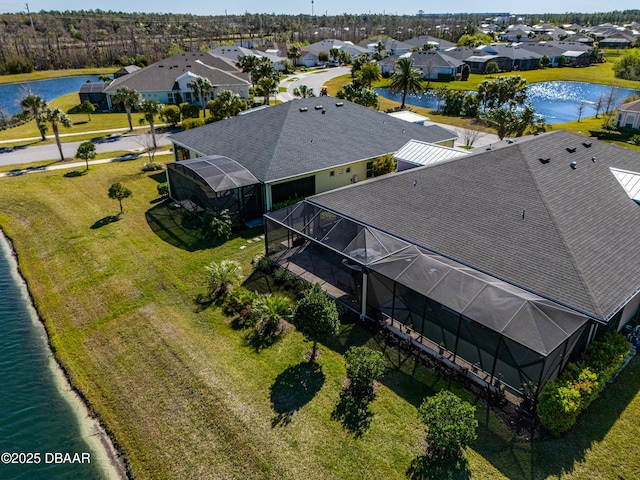 bird's eye view featuring a residential view and a water view