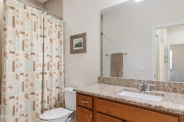 bathroom with a shower with curtain, vanity, and toilet