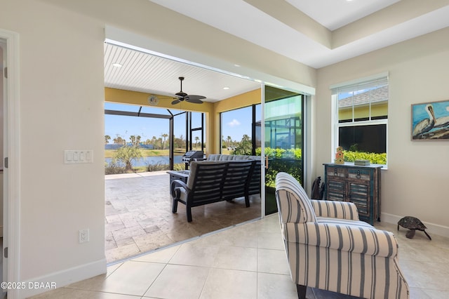 view of patio / terrace with a ceiling fan, outdoor lounge area, and a water view