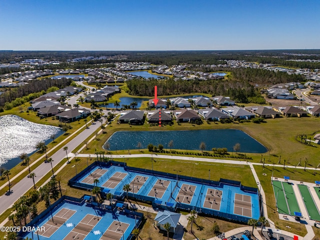 drone / aerial view with a residential view and a water view