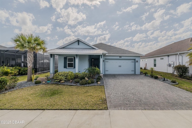 ranch-style home with a garage, a lanai, and a front yard