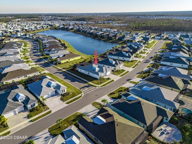 aerial view featuring a residential view and a water view