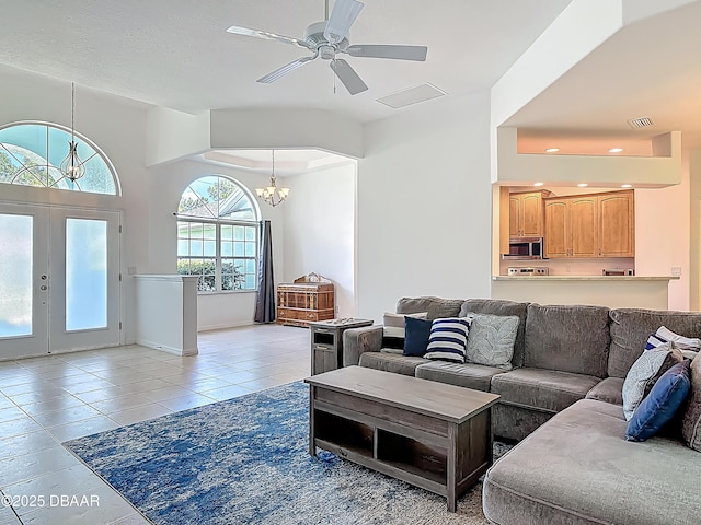 12 Kathleen Trl, Palm Coast, FL 32164 - living area featuring a chandelier, light tile patterned floors, french doors, recessed lighting, and a ceiling fan