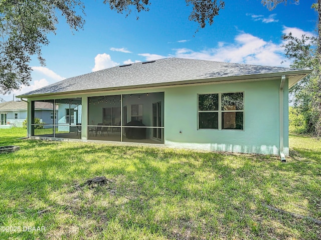 12 Kathleen Trl, Palm Coast, FL 32164 - back of house featuring stucco siding, a yard, a sunroom, and a shingled roof