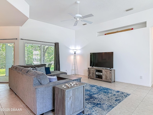 12 Kathleen Trl, Palm Coast, FL 32164 - living room featuring light tile patterned flooring, a ceiling fan, and baseboards
