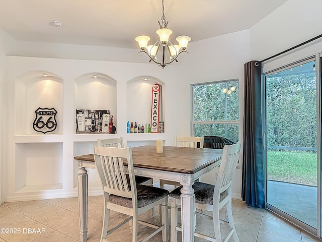 12 Kathleen Trl, Palm Coast, FL 32164 - dining space featuring a chandelier, light tile patterned floors, healthy amount of natural light, and built in shelves