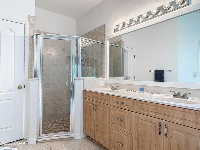 12 Kathleen Trl, Palm Coast, FL 32164 - full bathroom with a shower stall, double vanity, and tile patterned floors