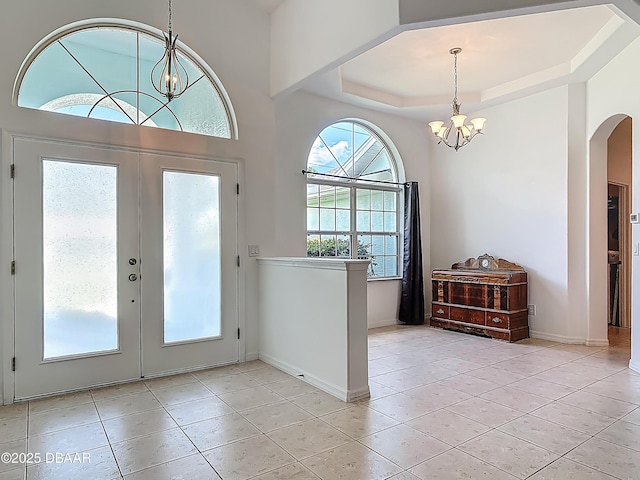 12 Kathleen Trl, Palm Coast, FL 32164 - entryway featuring a chandelier, french doors, and tile patterned flooring