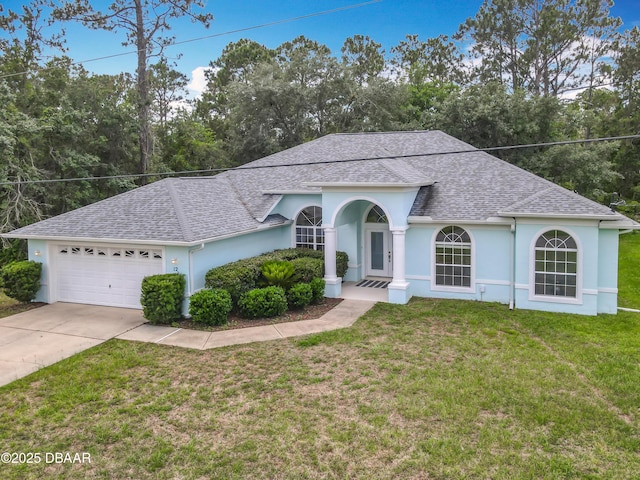 12 Kathleen Trl, Palm Coast, FL 32164 - single story home with a shingled roof, stucco siding, a garage, and a front yard
