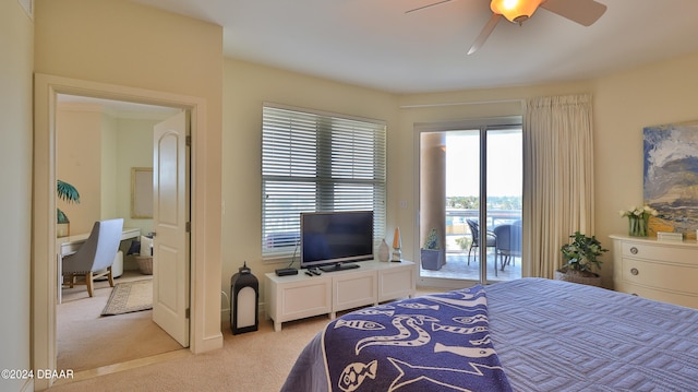 carpeted bedroom featuring ceiling fan and access to exterior