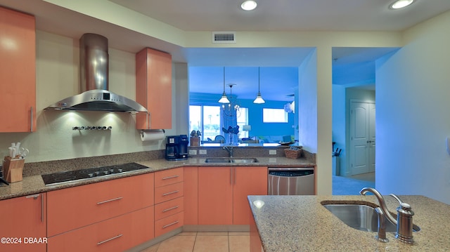 kitchen with dishwasher, stone counters, sink, and wall chimney exhaust hood